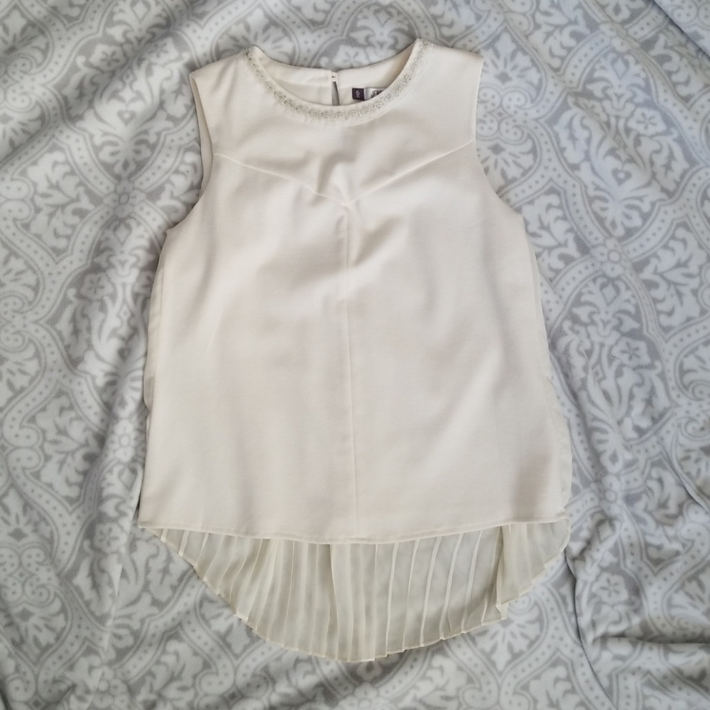 Jennifer Lopez cream sleeveless top